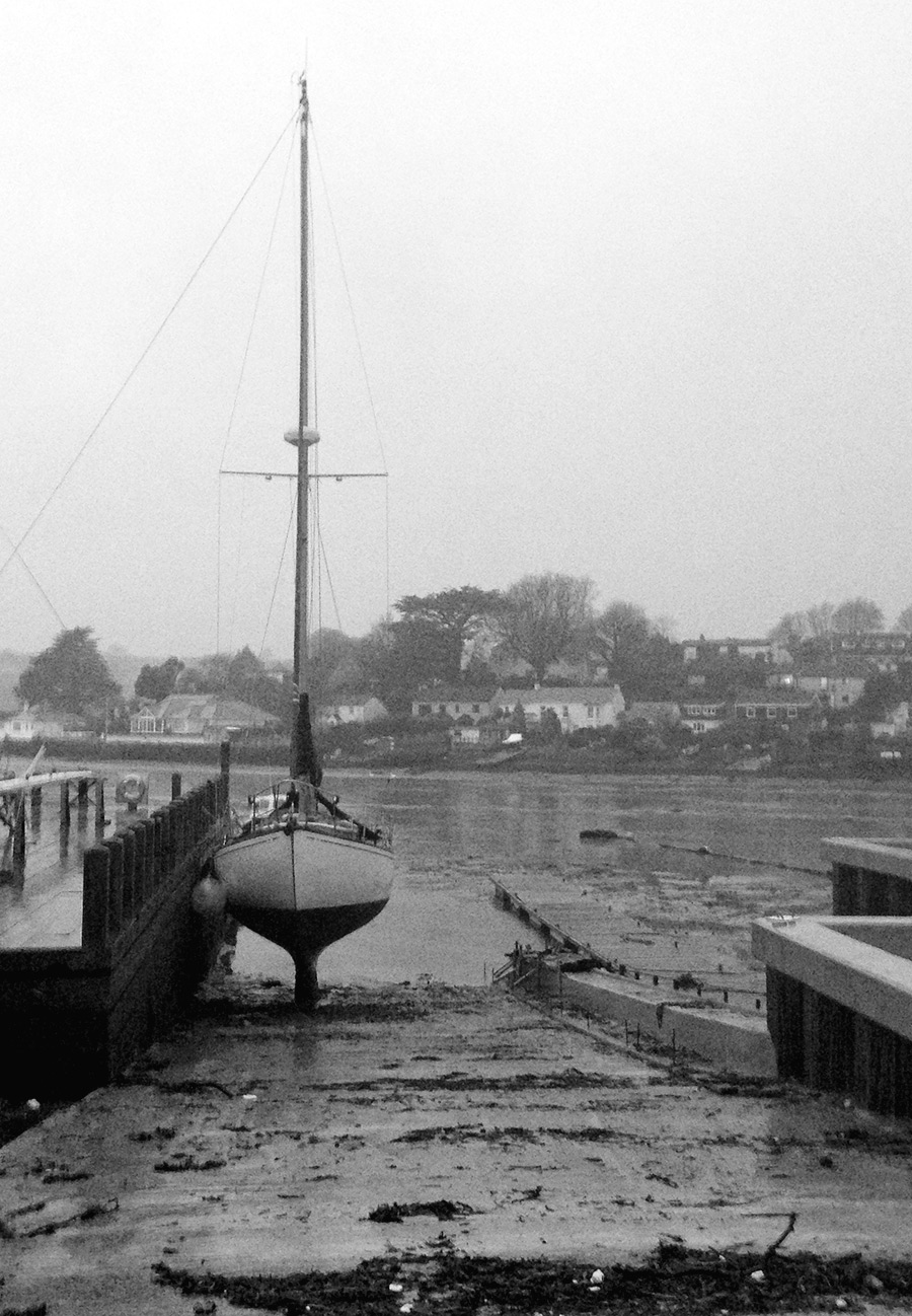 moored yacht,  low tide Penpol Creek